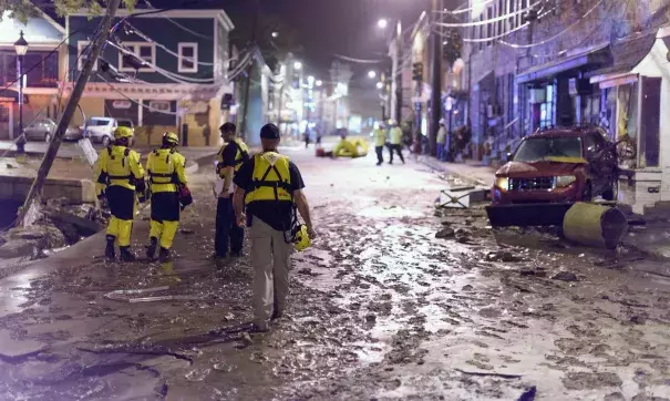 Officials assess damage along Main Street in Old Ellicott City. Photo: NBC News