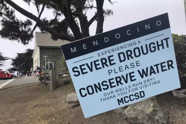 FILE— Signs alert visitors to the severe drought in Mendocino, Calif., on Wednesday, Aug. 4, 2021. California Gov. Gavin Newsom threatened Monday, May 23, 2022, to impose mandatory, statewide restrictions on water use if people don't start using less on their own as the drought drags on and the hotter summer months approach. (Credit: AP Photo/Haven Daley, File)