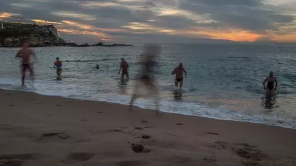 Swimmers enjoy the warm weather at Coogee Beach on Tuesday. Photo: Wolter Peeters