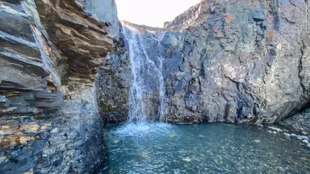 Meltwater flows off the Greenland ice sheet. (Credit: Jeremy Harlan/CNN)