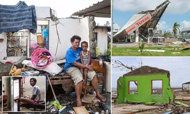 Fijian woman Kalisi holds her son Tuvosa, 3, as she sits on a bed in the remnants of her home damaged by Cyclone Winston in the Rakiraki District of Fiji's Ra province. Photo: Reuters