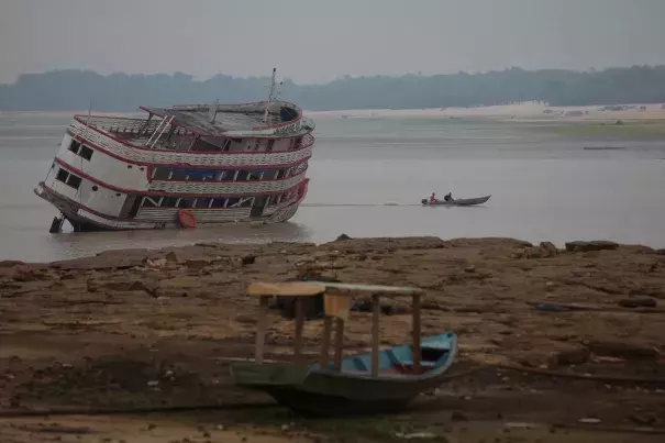 Stranded boats on the Rio Negro River, a tributary of the Amazon, in Manaus, Brazil, in October. (Credit: Bruno Kelly/Reuters)