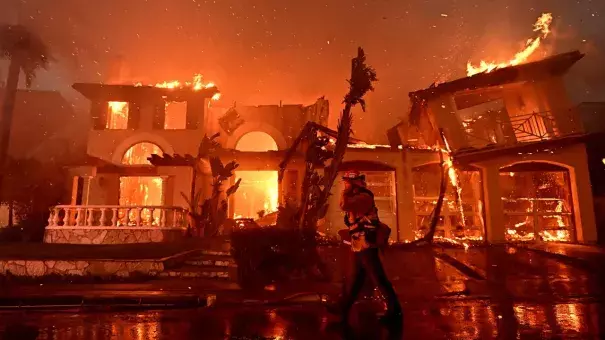 Firefighters battle a brush fire that destroyed several homes in Laguna Niguel, California, in May 2022. (Credit: Wally Skalij/Los Angeles Times/Getty Images)