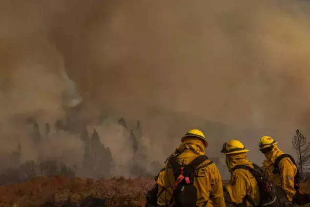 Smoke rises from the Oak Fire near Mariposa, Calif. on July 24, 2022. The wildfire burned through several thousand acres while Californians dealt with record-setting temperatures. (Credit: David McNew/AFP via Getty Images)