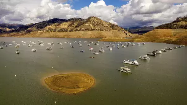 Houseboats float on Lake Oroville on Monday in Oroville, Calif.