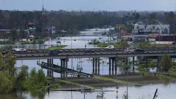 Homes and businesses are flooded in the aftermath of Hurricane Ida in LaPlace, La., Tuesday, Aug. 31, 2021. (Credit: Gerald Herbert/AP)