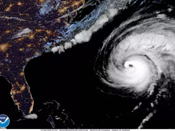 Hurricane Fiona moves up the United States Atlantic coast, Thursday night, Sept. 22, 2022. This image provided by the National Hurricane Center shows a satellite view as Hurricane Fiona pounded Bermuda with heavy rains and winds. (Credit: National Oceanic and Atmospheric Administration via NPR)