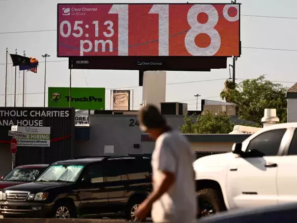 Tens of millions of Americans — including residents in Phoenix, where a billboard displays a temperature of 118 degrees last week — have been living under extreme heat warnings or advisories during the last few weeks. A new study finds climate change is making heat waves more common. (Credit: Patrick T. Fallon /AFP via Getty Images)