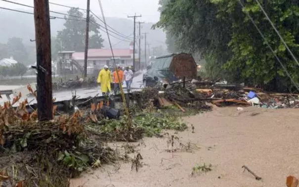 Debris from the Jordan Creek near Clendenin, W.Va., piles up against a culvert along U.S. 119 on June 23, 2016, before the creek's entry into the Elk River. Photo: Chris Dorst, Charleston Gazette, via AP