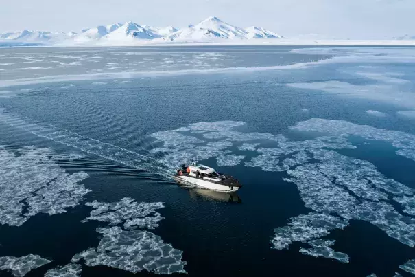 The Kvitbjorn (Polar Bear, in Norwegian) boat as it makes its way in the sea ice in the Borebukta Bay, located at the northwestern side of Isfjorden, in Svalbard Archipelago, northern Norway. (Credit: Jonathan Nackstrand/AFP/Getty Images)