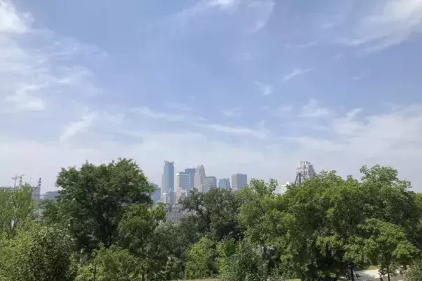 Smoke from Canadian wildfires leaves a haze over the downtown Minneapolis skyline on Tuesday, June 27, 2023. Drifting smoke from the ongoing wildfires across Canada is creating curtains of haze and raising air quality concerns throughout the Great Lakes region, and in parts of the central and eastern United States. (Credit: AP Photo/Steve Karnowski)