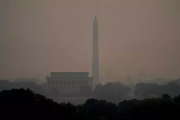 Haze blankets over monuments on the National Mall in Washington, Wednesday, June 7, 2023, as seen from Arlington, Va. Smoke from Canadian wildfires is pouring into the U.S. East Coast and Midwest and covering the capitals of both nations in an unhealthy haze. (AP Photo/Julio Cortez)