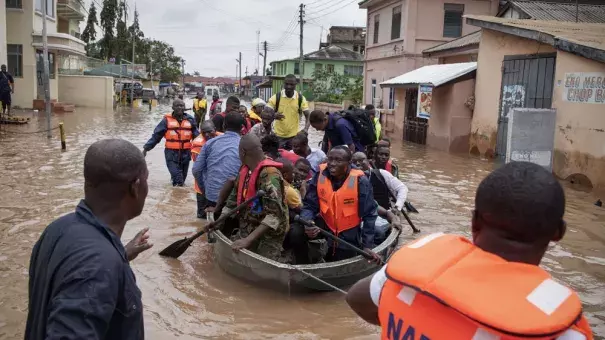 Rescue workers from Ghana's emergency services were called in to help as floods hit the capital city, Accra. Photo: Christian Thompson / EPA