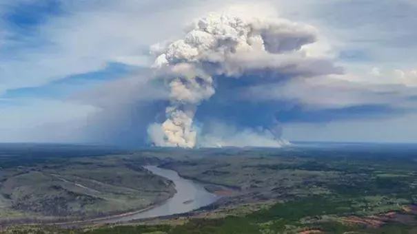 Smoke rises at Fort McMurray in Alberta, Canada on May 4, 2016. Pyrocumulus clouds formed by major wildfires can sometimes develop into pyrocumulunimbus clouds intense enough to generate lightning, hail, high winds, and tornadoes. Photo: @tamarackaspenbirch/Instagram