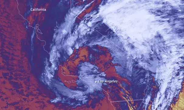 Infrared image of California and surrounding states on January 9, 2018, from the NOAA/NASA Suomi-NPP satellite. A large comma-shaped winter storm is draped over the state, it's coldest cloud tops appearing in light blue and white. Image: Dan Pisut, NOAA EVL, Climate.gov