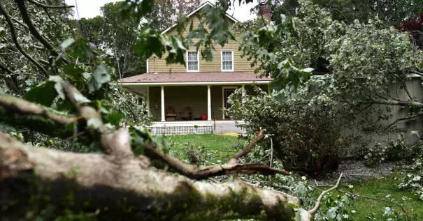 Debris cluttered Betty and Tom Therrien’s yard after a tornado swept through the area near Douglas, Mass., last month. Photo: Christine Peterson, Worcester Telegram & Gazette via Associated Press