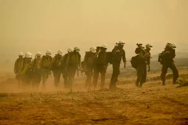 Members of the Craig Hotshots return to their crew cabs after a long day of fighting the Weston Pass Fire on July 2, 2018 near FairPlay. Credit: Helen H. Richardson, The Denver Post